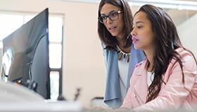Photo of two nurses at computer