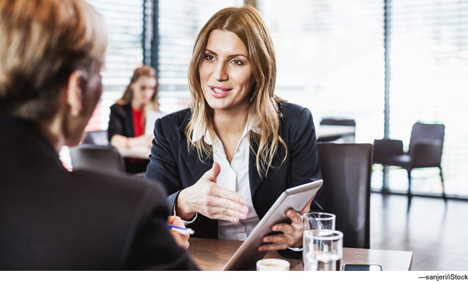 Woman talking to another person