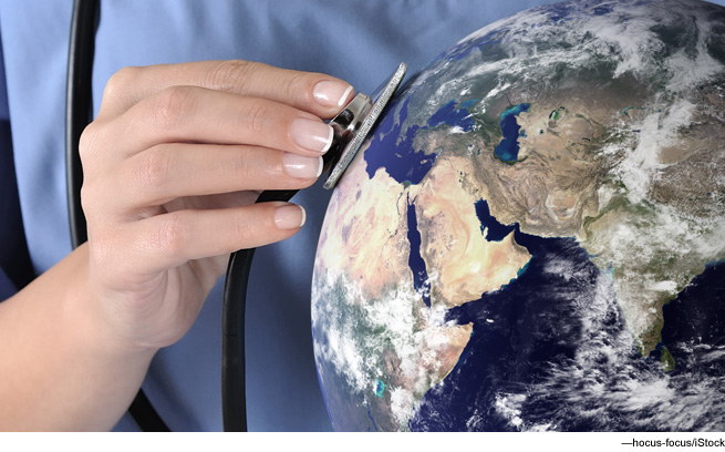 Stethoscope held against globe