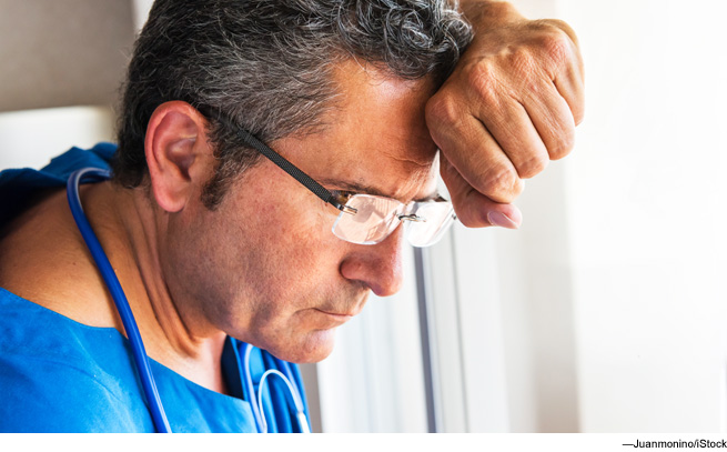 Man leaning against window