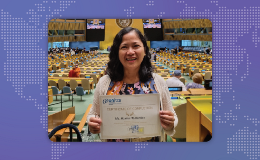 Monina Hernandez at the UN holding her certificate of completion.