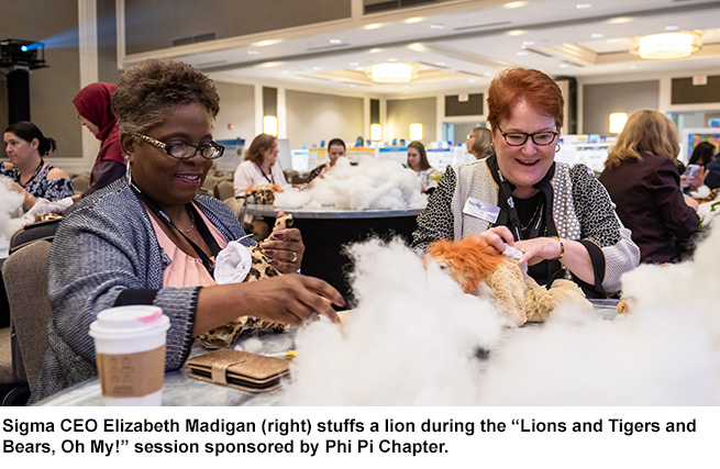 Sigma CEO Elizabeth Madigan helps stuff animals.